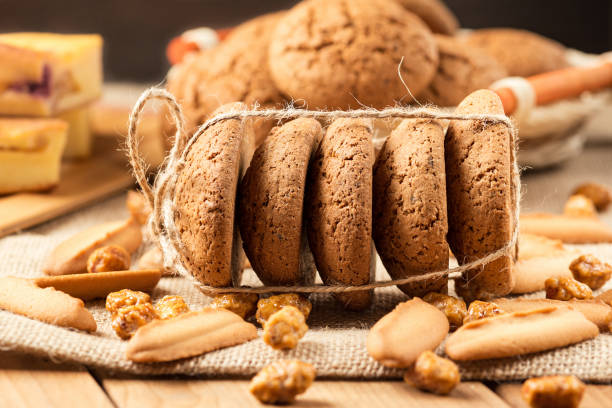 istock Oatmeal and shortbread cookies on burlap on a wooden table. 1137961771
