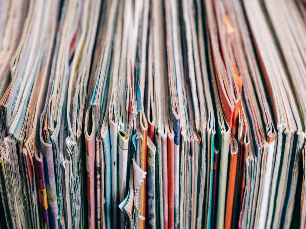 istock Macro closeup of pages in stack magazines 1137961858