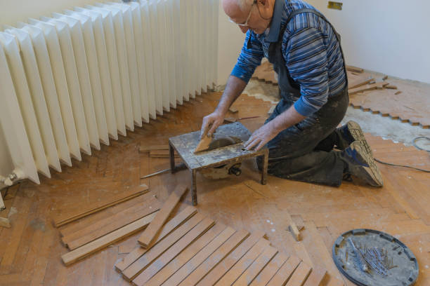 istock Senior Parquet Worker is Cutting the Floor Boards with Chop Saw 1137963622