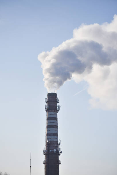 istock Industrial smoke from a chimney against the sky 1137963844