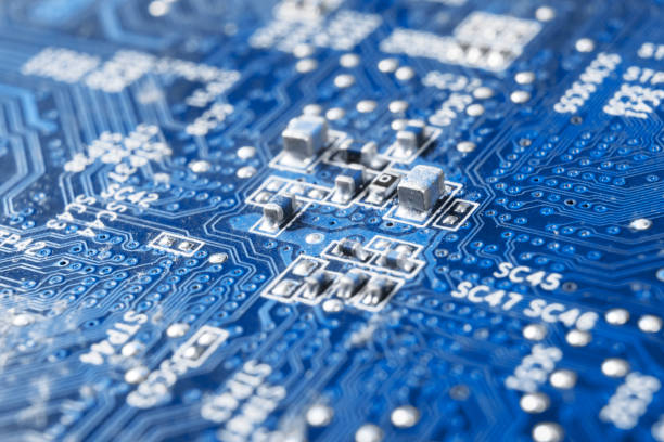istock Macro shot of Circuit board with resistors microchips and electronic components. Computer hardware technology. Integrated communication processor. Information engineering. Semiconductor. PCB. Closeup 1137964084
