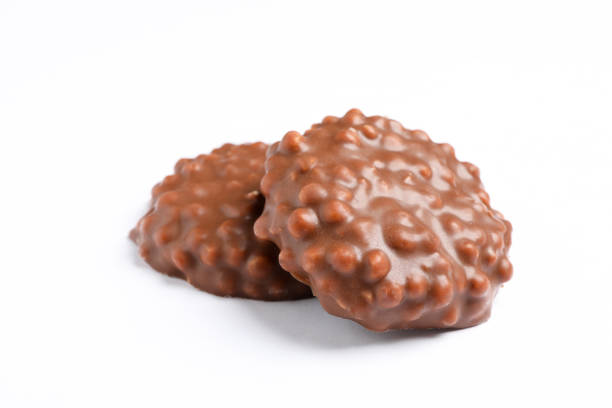 istock Chocolate cookies with caramel filling on white background 1137964696