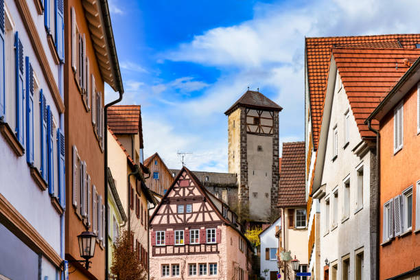 Narrow street in Rottenburg am Neckar with Schüttelturm (Tower) in background stock photo