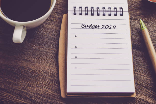 istock Budget 2019 text on book note with cup of coffee, pen. 1137965408