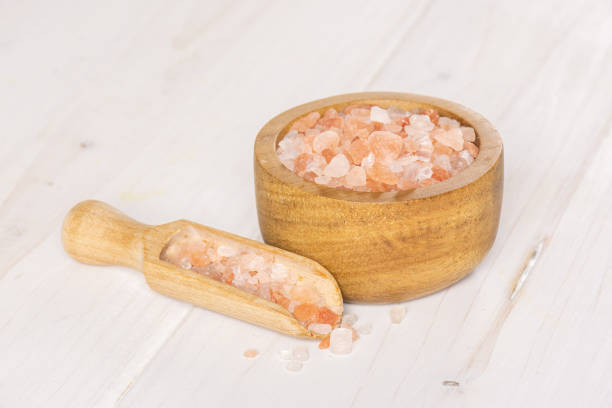 istock Pink himalayan salt crystals on grey wood 1137965608