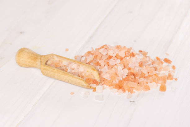 istock Pink himalayan salt crystals on grey wood 1137965729
