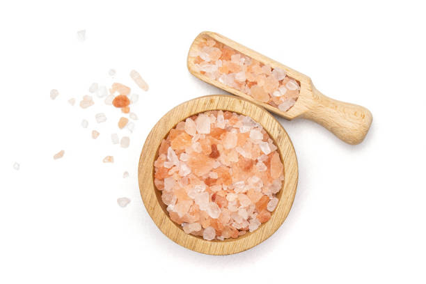 istock Pink himalayan salt crystals isolated on white 1137965750