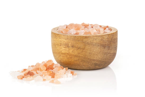 istock Pink himalayan salt crystals isolated on white 1137965756