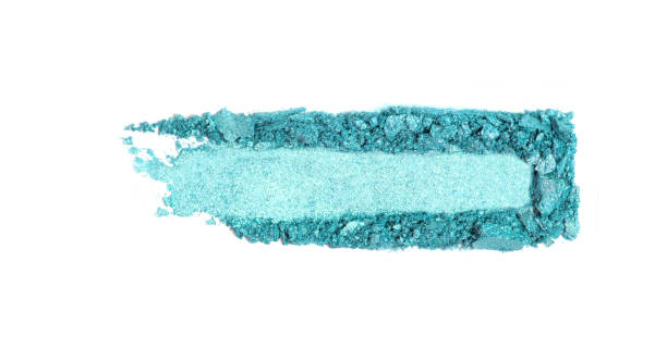 istock A broken green eye shadow smear, make up palette isolated on a white background. 1137966971