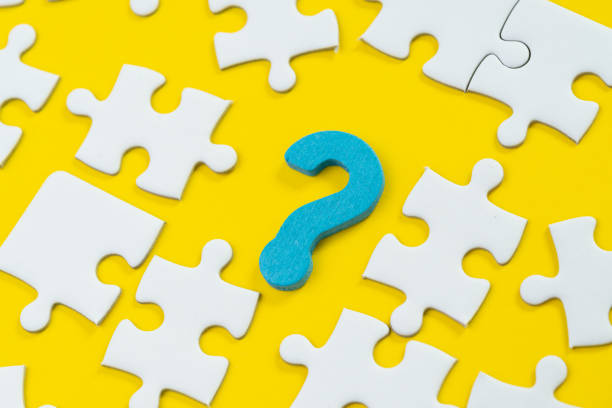 istock Asking question and answer for business solution, creativity or teamwork concept, blue wooden question mark symbol with white jigsaw puzzle on solid yellow background 1137967747