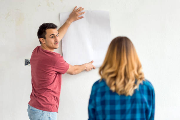 istock Couple choosing house wallpaper 1137967898