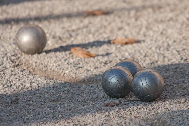 istock boule balls in the sand 1137968999