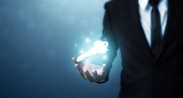 istock Businessman hand showing key to success. Problem solving to overcome work obstacles 1137969117