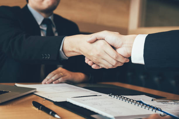 istock Confident manager and employee people shaking hands with making a interview contract in the office. 1137971201