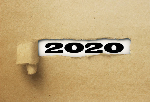 istock ripped or torn paper revealing new year 2020 on white background 1137972694
