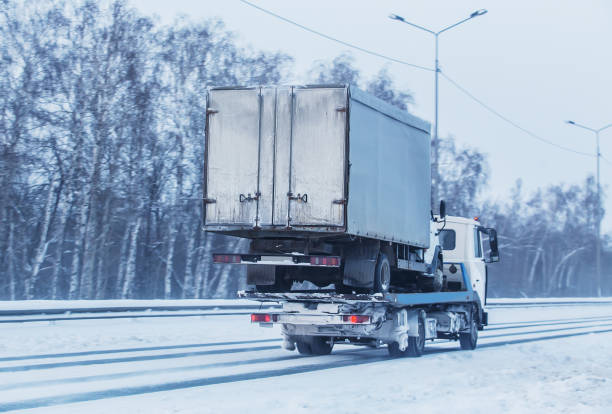 istock Car tow truck transports a broken truck 1137972708