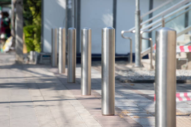 istock stainless steel bollards on footpath. 1137973432