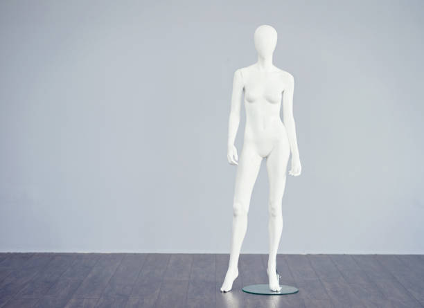 Who said this was the ideal shape of a woman? Studio shot of a white mannequin against a gray background mannequin photos stock pictures, royalty-free photos & images
