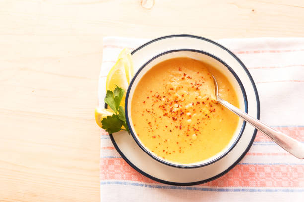 istock Traditional lentil soup in a white plate on a wooden table 1137977338