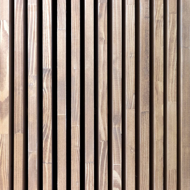 istock Texture wooden vertical stripes. Background natural tree with black stripes. Square size photo. 1137977834