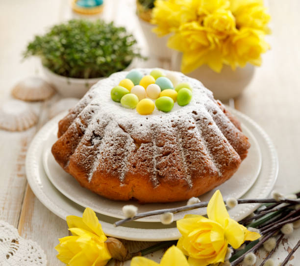 istock Easter yeast cake sprinkled with powdered sugar, decorated with marzipan eggs. 1137980415