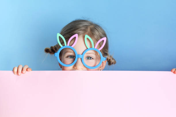 istock Easter girl portrait, funny emotions, surprise. Copyspace for text. 1137980547