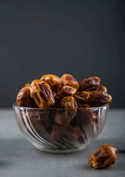 Bowl Full Of Dried Dates With Black Background