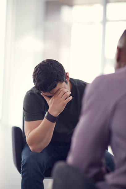 Please help me Shot of an unhappy young man talking with a colleague office buddies stock pictures, royalty-free photos & images