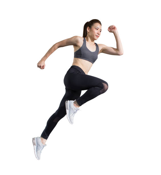 young asian fitness woman in sportwear  running  isolated on white background  with clipping path. exercise runner , jumping  girl , workout ,sport ,training stock photo