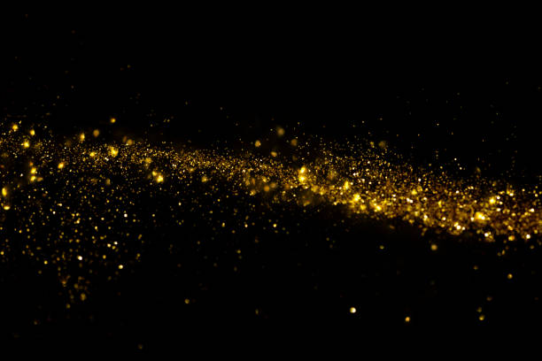 istock Waving golden glitter and confetti 1137984189