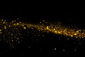 Waving golden glitter and confetti