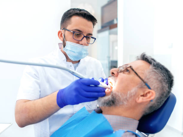 istock Mature man at the dentist 1137988299