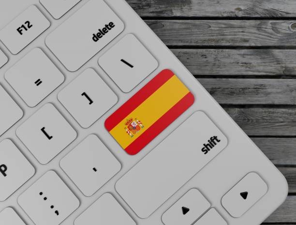 istock Spain flag enter key on white keyboard, on wood background. 3d render 1137989650