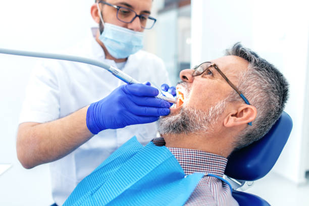 istock Mature man at the dentist 1137991045