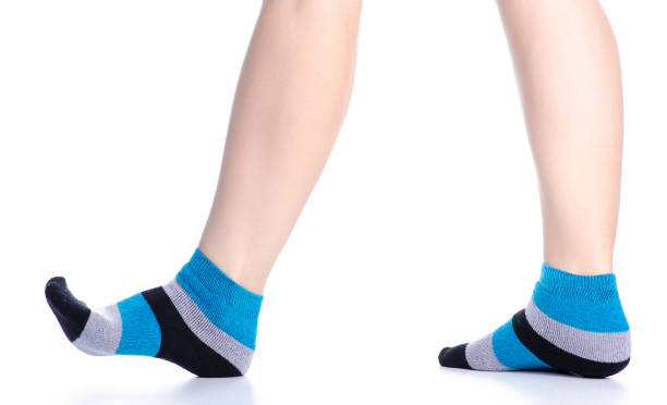 istock Female legs with socks fashion 1137991739