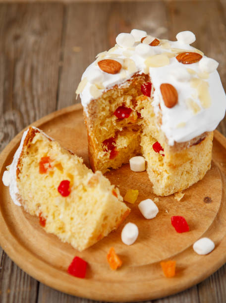 istock Easter composition. Easter cake decorated with almond petals on a rustic wooden background 1137994673