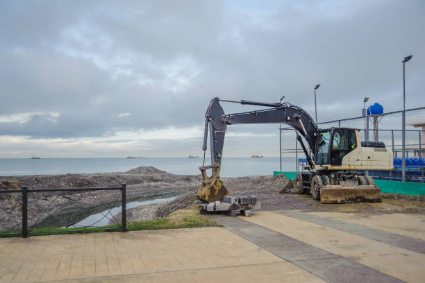 istock Excavator on the sea is digging a canal 1137999876