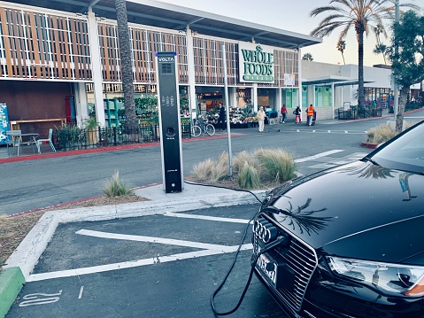 Venice, USA - January 4, 2019: Electric Car, Audi, charging on Whole Foods Market parking in Venice, California