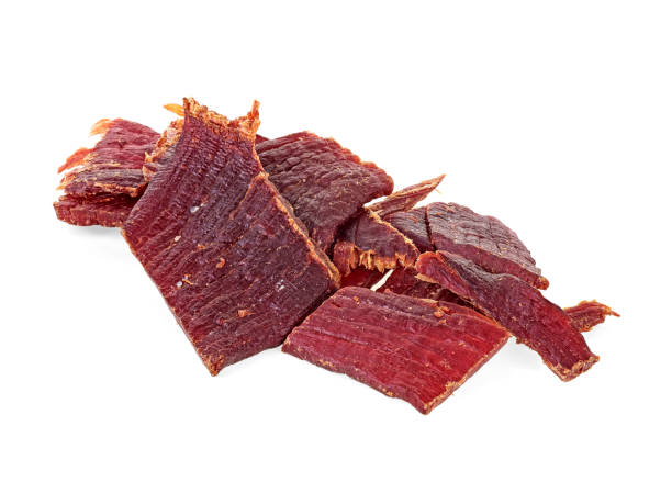 istock Pile of beef jerky pieces on a white background 1138000852