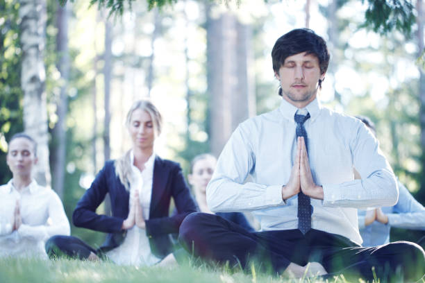 istock Business people practicing yoga 1138001211