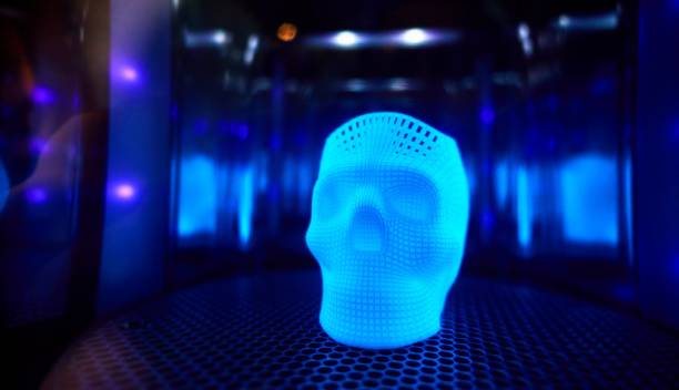 istock Ultraviolet polymerization of 3D printed glowing skull in mirror sealed chamber 1138002641