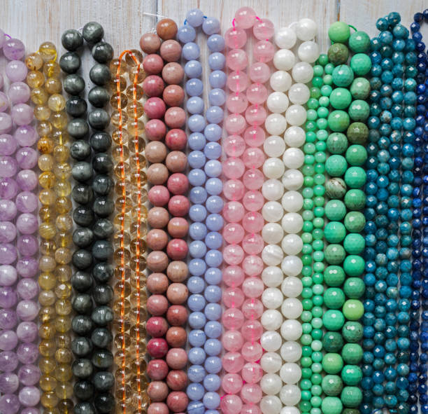 istock Beads from various natural stones are strung on threads 1138003449