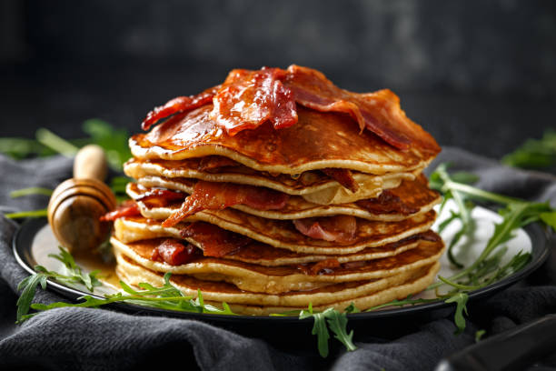 istock Pancakes with crispy bacon and maple syrup in a plate. Morning Breakfast 1138004846