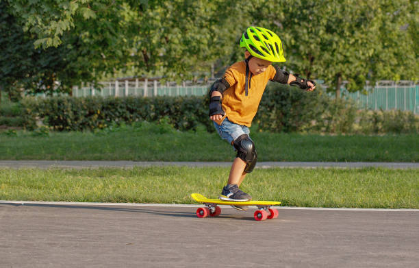 istock A little boy enjoys a yellow cruiser penny plastboard 1138004982