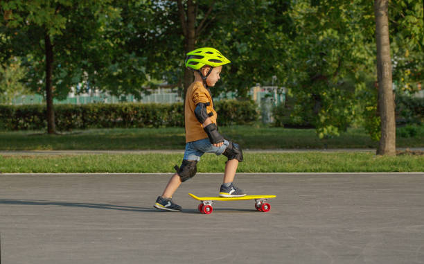 istock A little boy enjoys a yellow cruiser penny plastboard 1138004983
