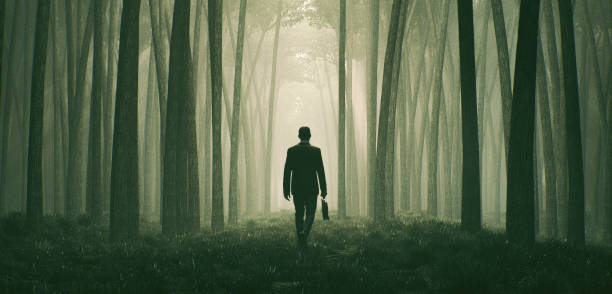 Lost businessman walking in the forest at night Lost businessman walking in the forest at night. This is entirely 3D generated image. light at the end of the tunnel photos stock pictures, royalty-free photos & images