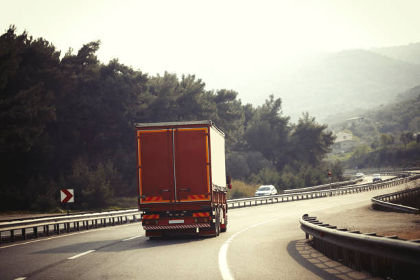 istock Red Truck On Highway 1138008095