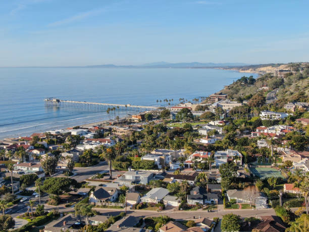 Aerial view of the scripps pier institute of oceanography, La Jolla, San Diego, California, USA. Aerial view of the scripps pier institute of oceanography, La Jolla, San Diego, California, USA. Research pier used to study ocean conditions and marine biology.  Pier with luxury villa on the coast. la jolla stock pictures, royalty-free photos & images