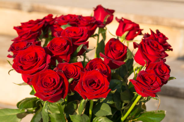 istock bouquet of blossoming dark red roses 1138010074