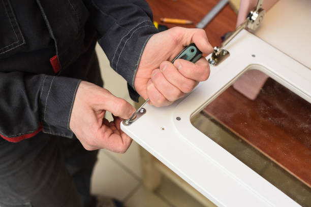 istock Carpenter working on white color play kitchen oven door 1138015594